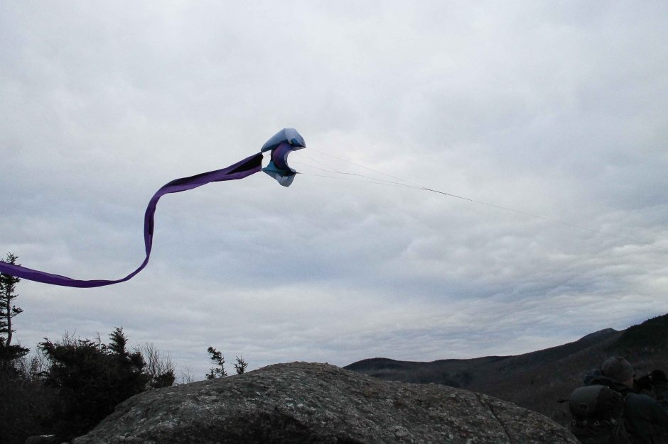 Flying a kite on a mountain